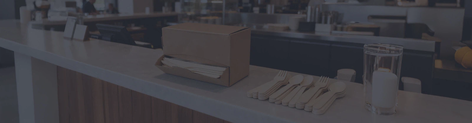custom-branded birchwood cutlery arranged neatly on a table in a modern restaurant custom-branded birchwood cutlery arranged neatly on a table in a modern restaurant